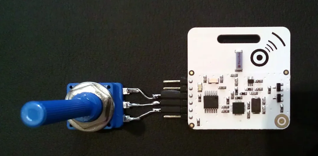 OpenBeacon sensor tag wired to a blue potentiometer knob
